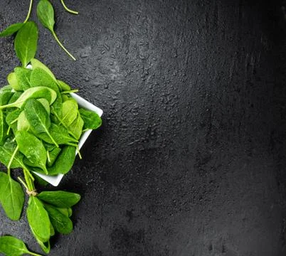 Spinach on a vintage background (close-up; selective focus) Stock Photos