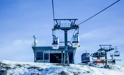 Spinale cable car is approaching to the chairlift station. Stock Photos