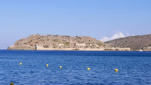 Spinalonga Island and beach with safety buoys panorama, Crete Stock Footage 100395794