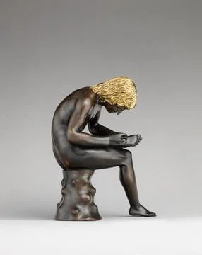 Spinario (Boy Pulling a Thorn from His Foot) probably modeled by 1496, cast.. Stockfoto's
