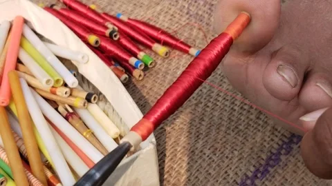 Spindle rolling silk thread by charkha or spinning wheel in India 스톡 동영상 254529051
