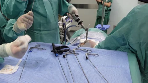 Spine Surgeon Performing Surgery in the Operating Room Stock Footage 151460528