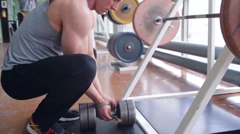 Spine workout with dumbbell Stock Footage 64321091