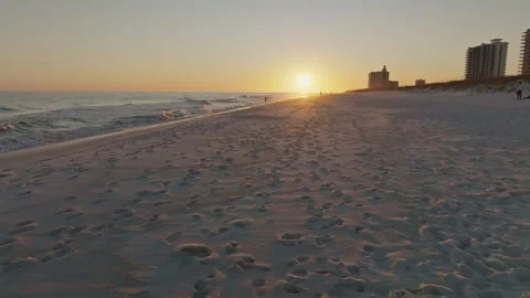 Spining ariel drone shot of sunset at golden hour on Pensacola beach at sunset Stock Footage 302192239