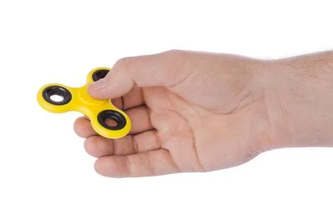 Spinner in hand Spinner in hand isolated on white background Copyright: xZ... Stock Photos