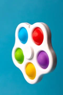 Spinner pop-it simple simple on a blue background Stock Photos