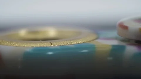 Spinner rotates on black background macro Stock Footage 107008659