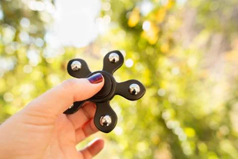 Spinners in the hand Stock Photos