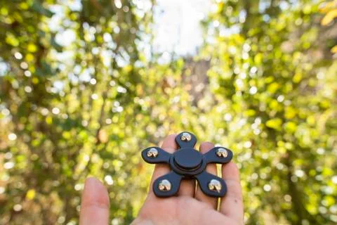 Spinners in the hand Stock Photos