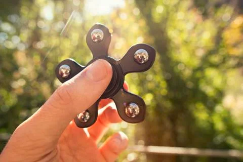 Spinners in the hand Stock Photos