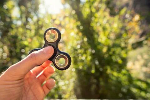 Spinners in the hand Stock Photos