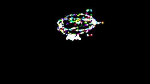 Spinning 3d blimp with colorful glitter sparkles on plain black background Stock Footage 313744792