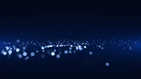 A spinning and upward moving source of blue sparkling particles Stock Footage 254974201