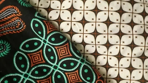 Spinning batik fabric, Indonesia unique pattern textile, textured background Stock Footage 273296406