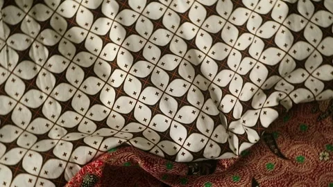 Spinning batik fabric, Indonesia unique pattern textile, textured background Stock Footage 273296625