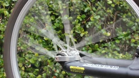 Spinning bicycle wheel Stock Footage 12471638