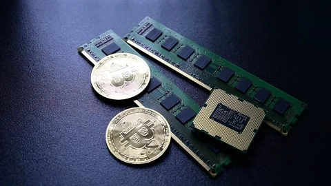 Spinning bitcoin coin sliding into frame near computer hardware represent crypto Stock Footage 331188671