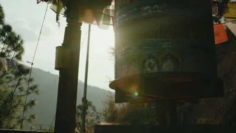 Spinning Buddhist Prayer Wheel with Sun Flare in the Mountains of Bhutan Stock Footage 342141938