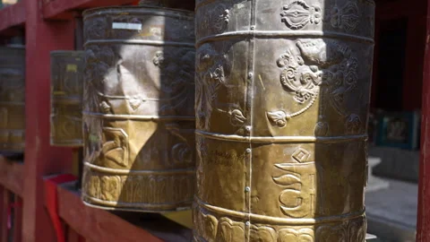 Spinning Buddhist Prayer Wheels in Sunlight at Tibetan Monastery Stock Footage 327177329