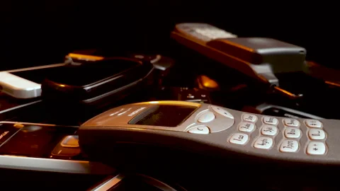 Spinning Bunch of Old Used Cellular Phones, Nokia, Motorola, Samsung, GSM Stock Footage 136753311