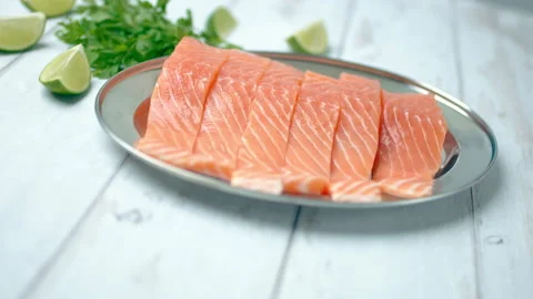 Spinning camera capturing slices of fresh raw red salmon. Stock Footage 132786627