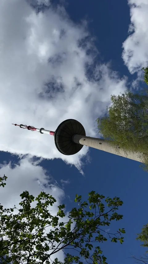 Spinning camera shot of TV tower in Vilnius. Vertical video Stock Footage 275167695