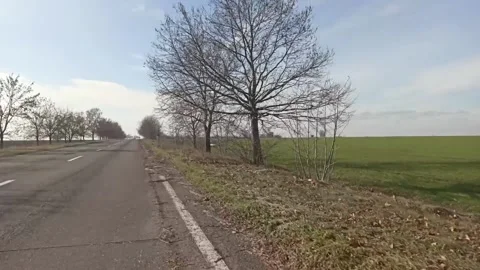 Spinning car wheel in motion Stock Footage 147668805