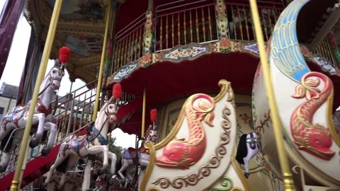 A spinning carousel with horses Stock Footage 169560700