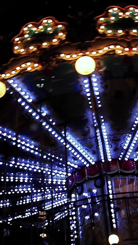 Spinning Carousel with Lights by the Eiffel Tower in Paris at Night - 4K Stock Footage 285345180