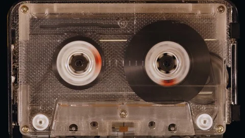 Spinning Cassette Tape Time-Lapse Fast Forward and Rewind Stock Footage 119546883