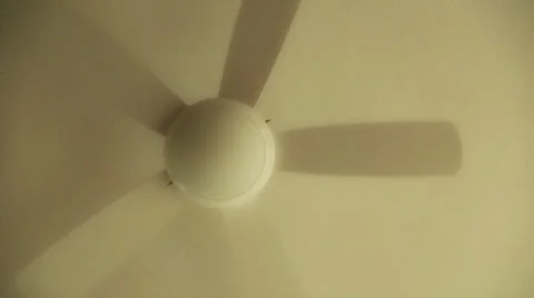 A spinning ceiling fan from below Stock Footage 32884363