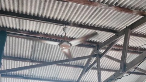 Spinning Ceiling Fan in Rustic Malaysian Roof Stock Footage 327483106