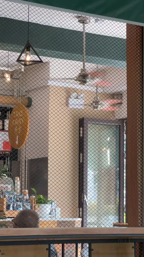 Spinning Ceiling Fans Inside a Coffee Shop Stock Footage 309011507