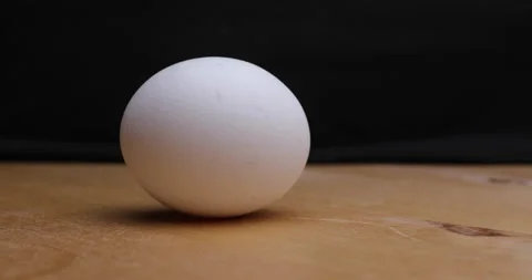 Spinning the chicken egg Stock Footage 156859386