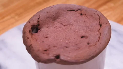 Spinning Chocolate Cake in a Mug Close Up on Marble Over Wood Video stock 128162831