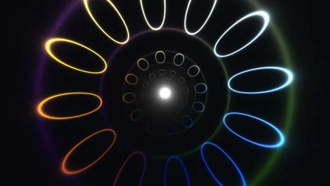 Spinning circles of light create visual motion in dark Stock Footage 338009212