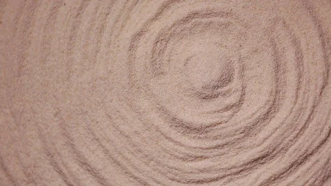 Spinning circles in the sand Stock Footage 103508031
