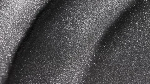 Spinning close-up of dark titanium paint specialized sandy texture and radiant Stock Footage 327604233