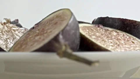 Spinning Close Up of Fresh Sliced Figs Showing Detailed Seed Filled Interior on Stock Footage 346293555