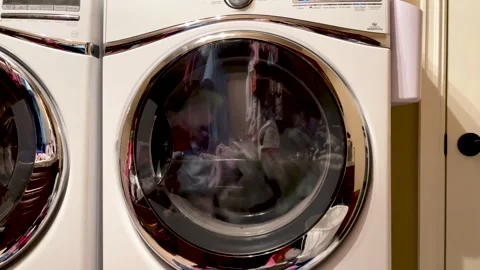 Spinning Clothes in Dryer Stock Footage 247032051