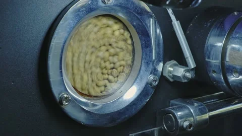 Spinning coffee beans in the roaster window. Stock Footage 142087809