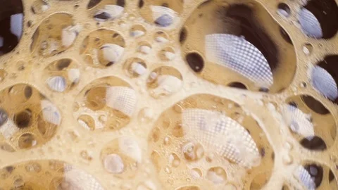 Spinning coffee bubbles in a cup. Abstract background Stock Footage 73700809