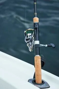 Spinning with the coil on the background of the river Stock Photos