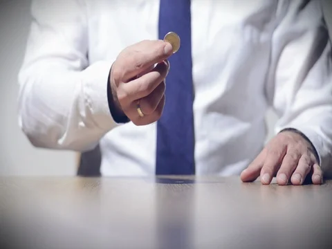 Spinning a coin Stock Footage 80281907