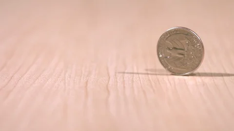 Spinning coin in slow motion Stock Footage 100873013
