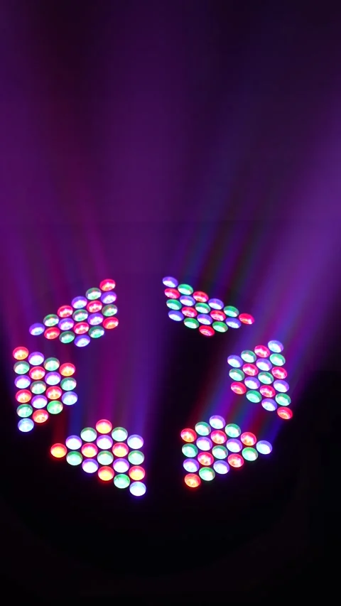 Spinning colorful LED moving head stage light Stock Footage 345739078