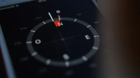 Spinning compass direction. digital compass on the iphone screen. 스톡 동영상 232995430