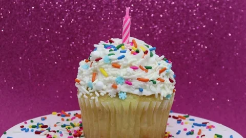 Spinning cupcake with candle Stock Footage 238607978