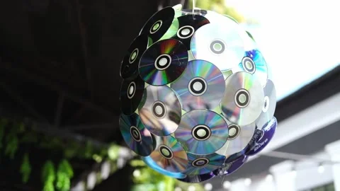 Spinning disco ball is made from CD compact disc outdoor. Stock Footage 318647085