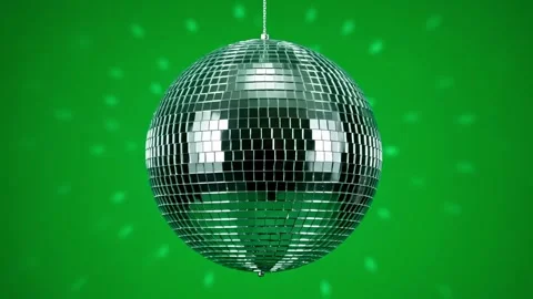 A spinning disco ball reflecting light on a vibrant green background Stock Footage 315277672
